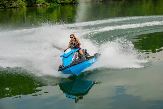 Slide: The Image of 2024 Yamaha Waverunner GP HO™ with Audio speeding on a lake, creating a splash. - 18