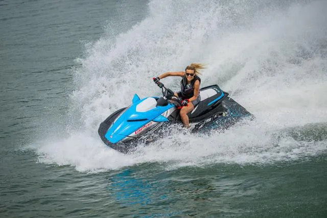 Slide: The Image of 2024 Yamaha Waverunner GP HO™ with Audio speeding on water, creating a splash. - 19