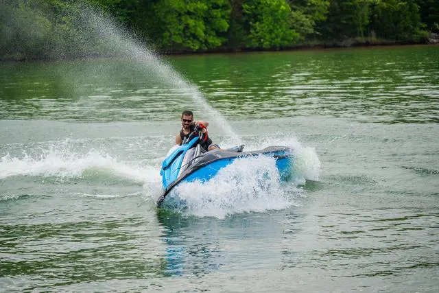 Slide: The Image of Man riding 2024 Yamaha Waverunner GP HO™ with Audio on a lake. - 21