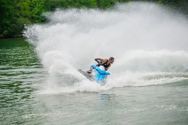 Slide: The Image of 2024 Yamaha Waverunner GP HO™ with Audio speeding on water, creating a large splash. - 23