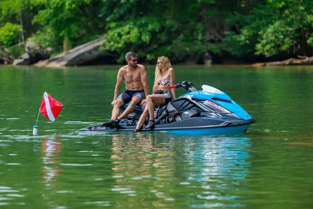 Slide: The Image of Couple enjoying a 2024 Yamaha Waverunner GP HO™ with Audio on a serene lake. - 31