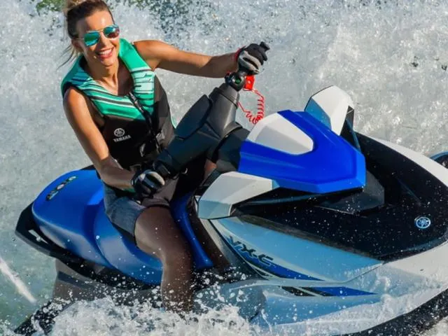 Slide: The Image of Woman riding 2024 Yamaha Waverunner VX-C on water, wearing a life vest and sunglasses. - 13