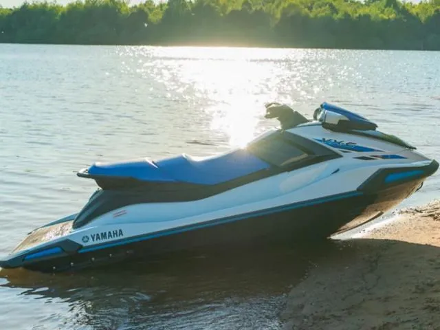 Slide: The Image of 2024 Yamaha Waverunner VX-C® on a sunny lakeside shore. - 14