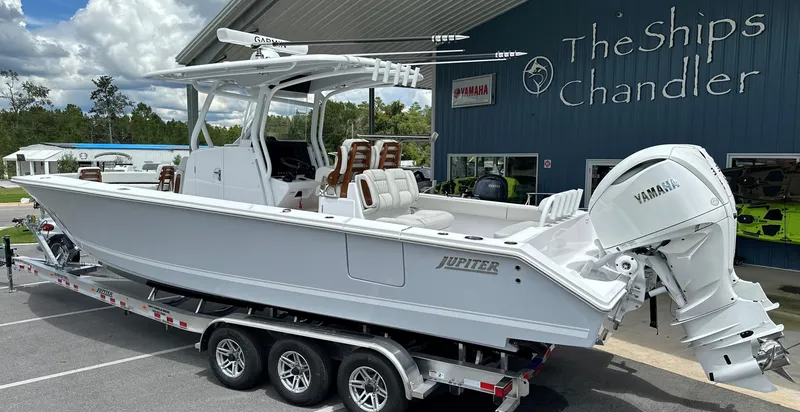 Slide: The Image of 2025 Jupiter 32 boat on trailer at The Ships Chandler dealership. - 1