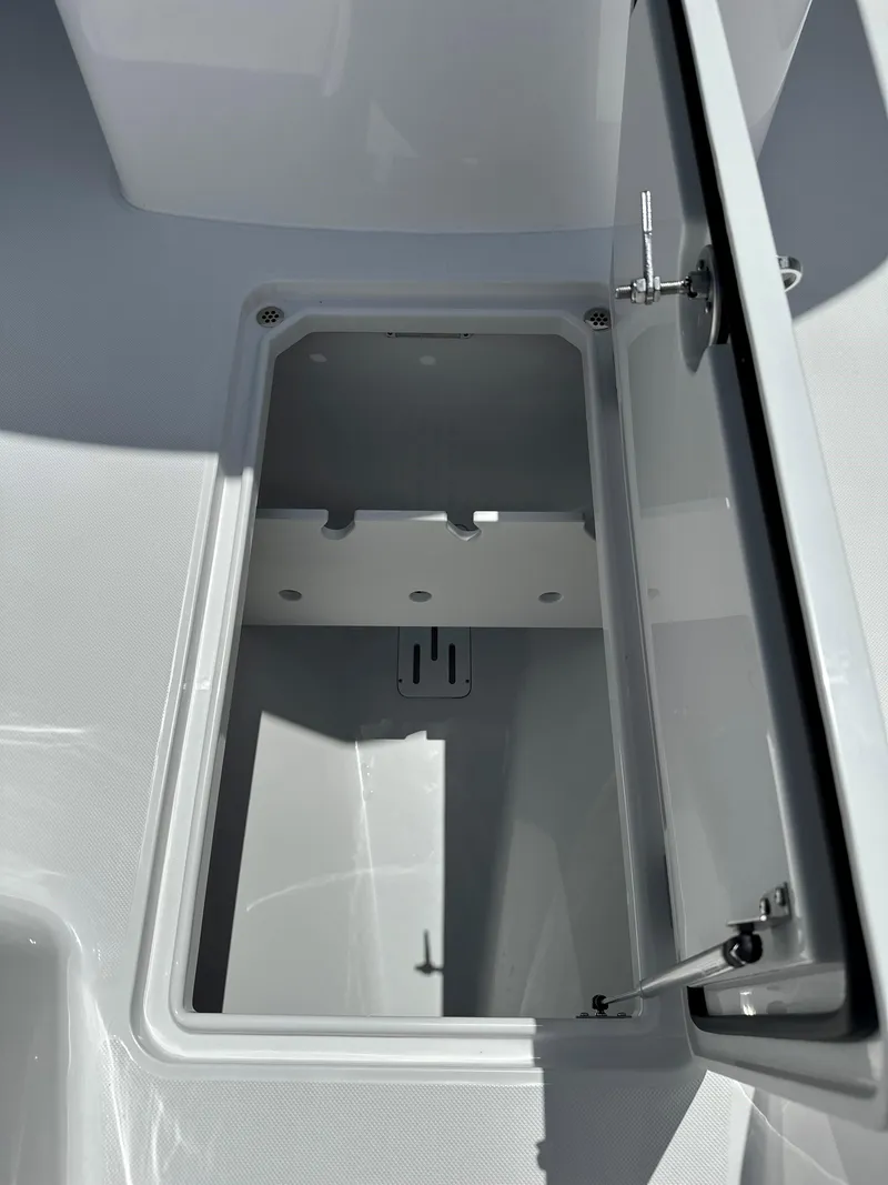 Slide: The Image of Open storage compartment on 2025 Jupiter 32 boat, showcasing interior space. - 14