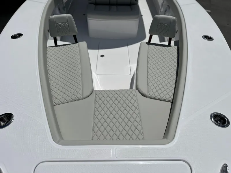 Slide: The Image of Luxurious seating on 2025 Jupiter 32 boat with diamond-stitched upholstery. - 15