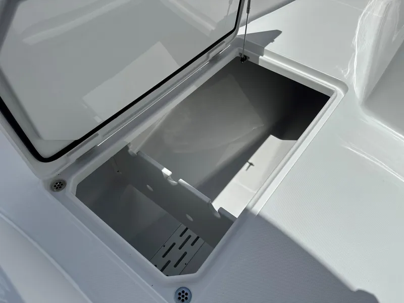 Slide: The Image of Open storage compartment on 2025 Jupiter 32 boat deck. - 17
