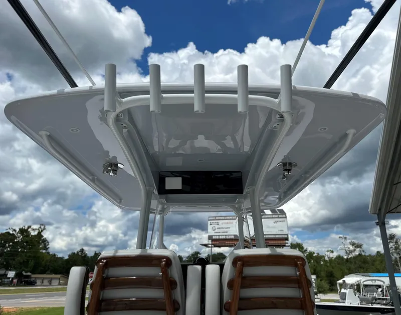 Slide: The Image of Jupiter 32 boat, 2025 model, featuring a sleek T-top under a cloudy sky. - 18