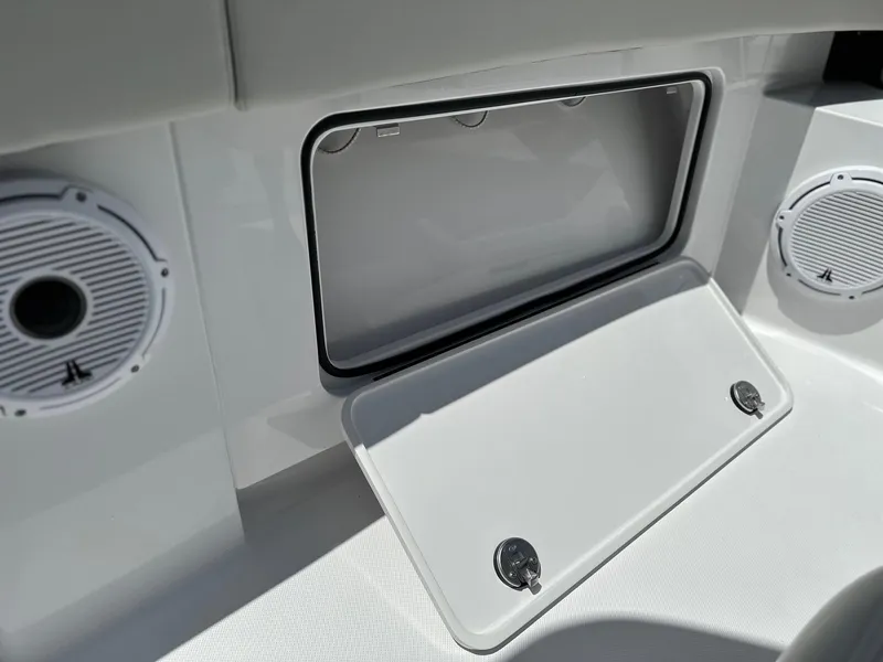 Slide: The Image of 2025 Jupiter 32 boat interior with speakers and storage compartment. - 22