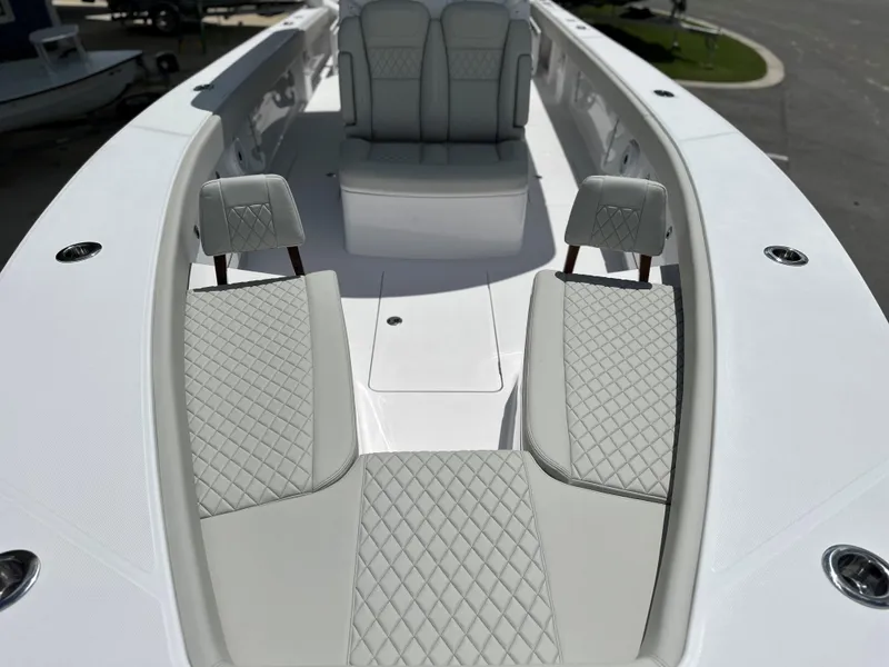 Slide: The Image of Luxurious seating on 2025 Jupiter 32 boat with diamond-stitched upholstery. - 24