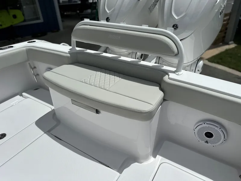 Slide: The Image of 2025 Jupiter 32 boat interior with cushioned seating and modern design. - 25