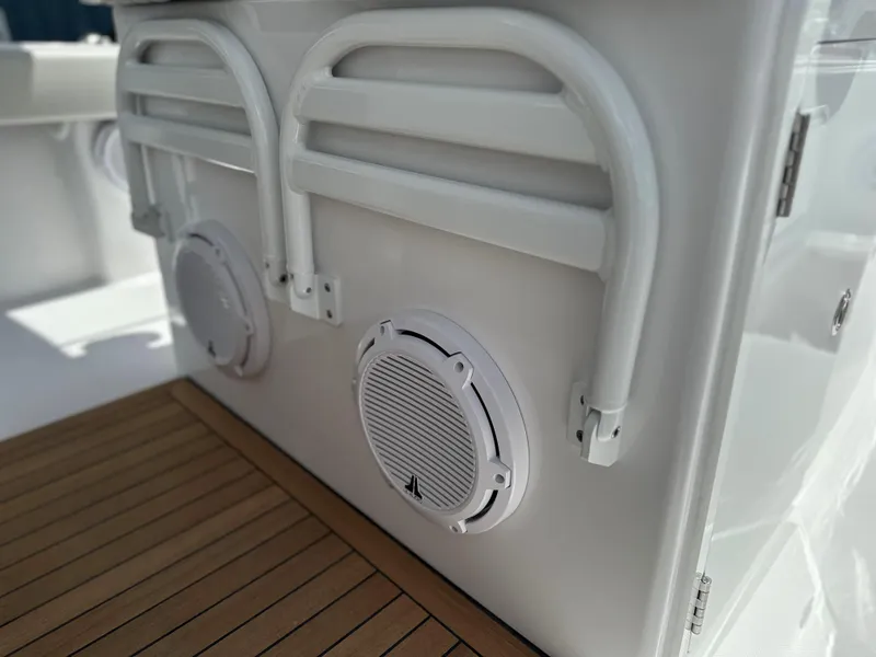 Slide: The Image of 2025 Jupiter 32 boat interior with speakers and wooden deck. - 29