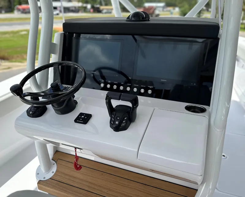 Slide: The Image of 2025 Jupiter 32 boat dashboard with steering wheel and controls. - 3
