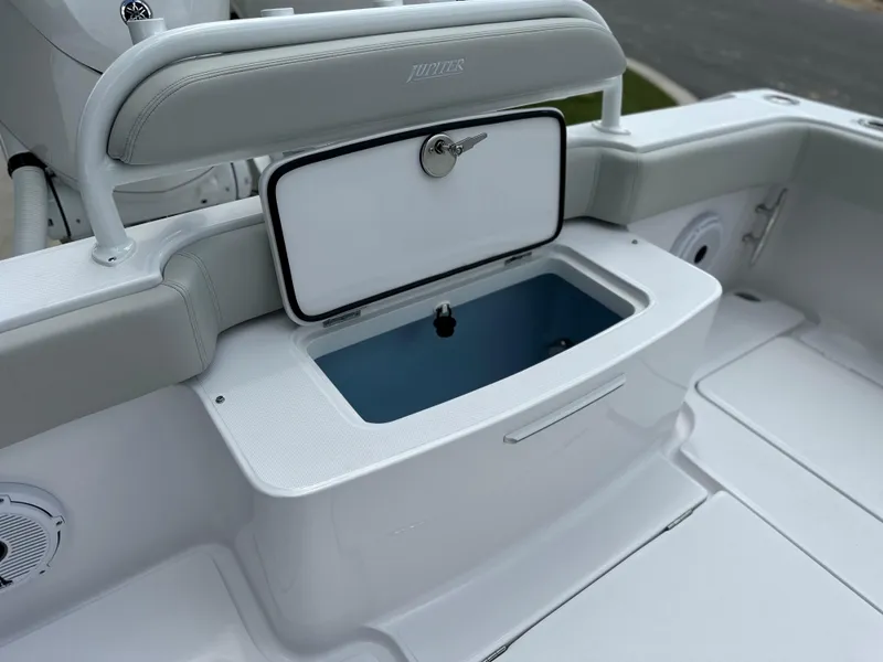 Slide: The Image of Jupiter 32 boat interior with open storage compartment, 2025 model. - 35