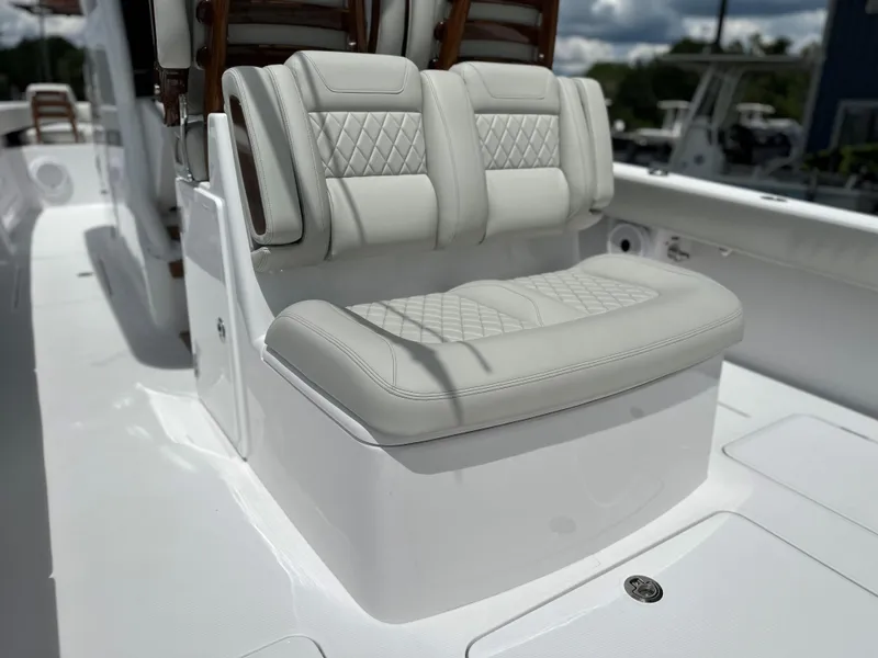 Slide: The Image of Luxurious seating on 2025 Jupiter 32 boat with quilted upholstery. - 37