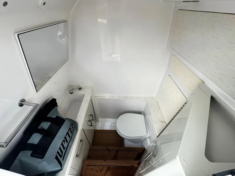 Slide: The Image of Modern bathroom interior in 2025 Jupiter 32 boat, featuring sleek design and compact amenities. - 7