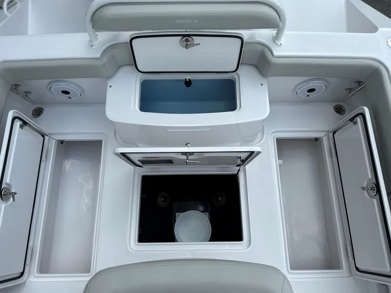 Slide: The Image of 2025 Jupiter 32 boat interior with storage compartments and seating. - 9