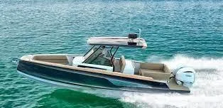 Slide: The Image of 2025 STERK 31 WB Sport boat cruising on clear blue water. - 22