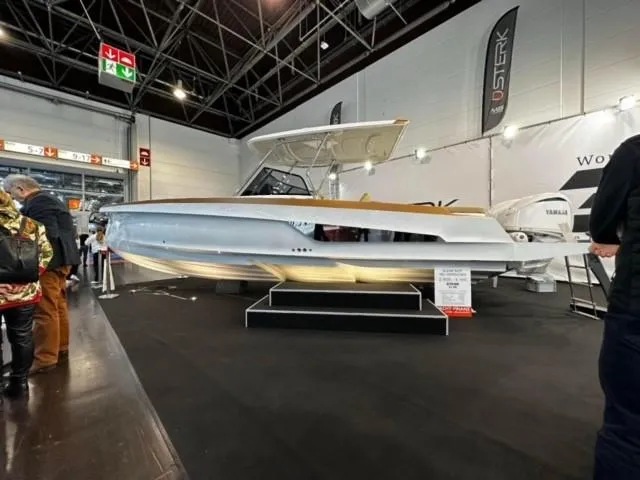 Slide: The Image of STERK 31 WB Sport 2025 boat displayed at an indoor exhibition. - 24
