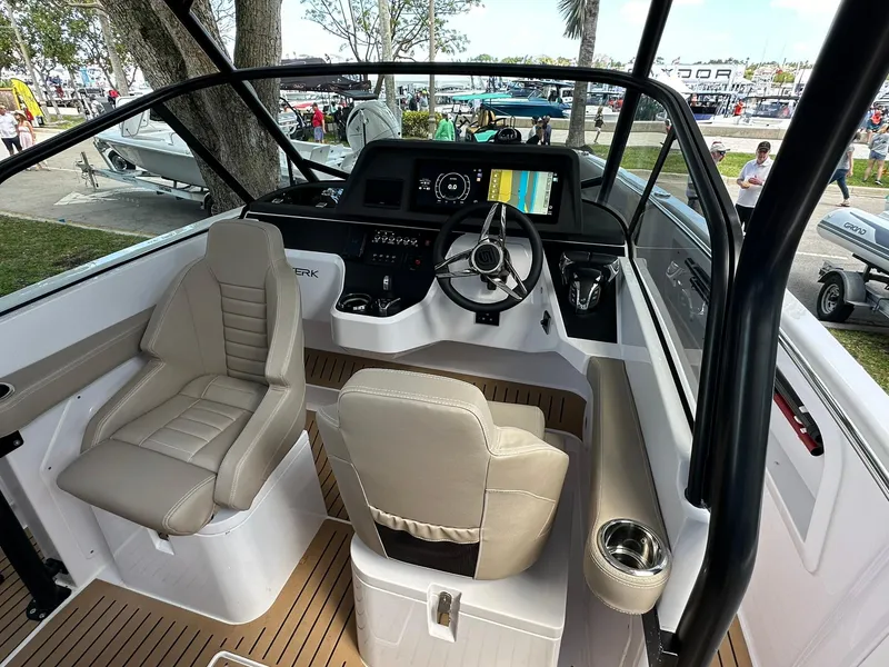 Slide: The Image of 2025 STERK 31 WB Sport boat cockpit with modern controls and seating. - 9