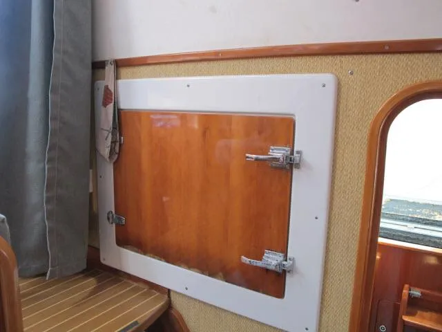 Slide: The Image of Wooden interior of 2000 Alliaura Privilege 37 yacht with storage compartment. - 14