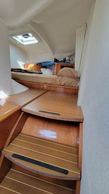 Slide: The Image of Interior of 2000 Alliaura Privilege 37 catamaran with wooden steps and cozy cabin. - 17