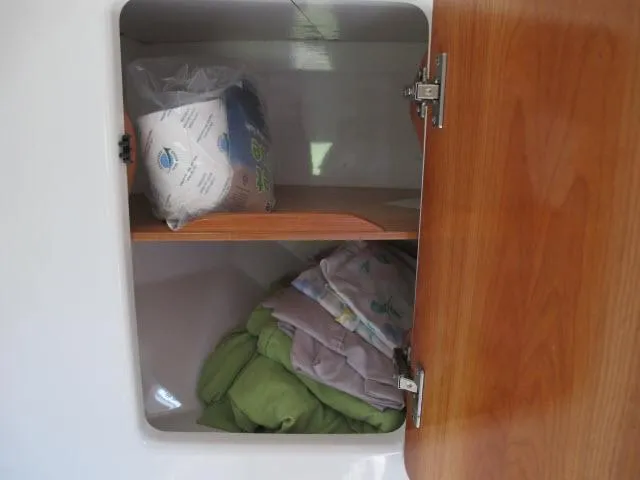 Slide: The Image of Cabinet storage on 2000 Alliaura Privilege 37 yacht with linens and supplies. - 21