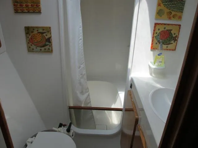 Slide: The Image of Bathroom interior of 2000 Alliaura Privilege 37 catamaran with shower and toilet. - 25