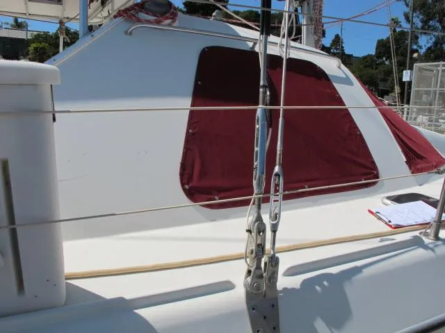 Slide: The Image of Alliaura Privilege 37 catamaran, 2000 model, with red window covers and deck details. - 35