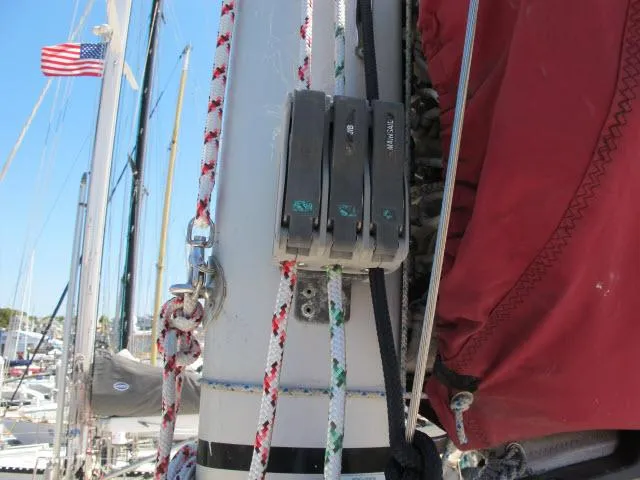 Slide: The Image of Close-up of rigging on a 2000 Alliaura Privilege 37 sailboat with American flag in background. - 37