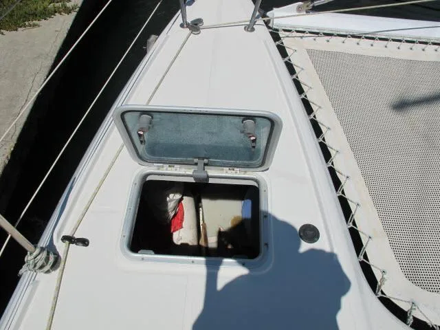 Slide: The Image of Open hatch on 2000 Alliaura Privilege 37 catamaran deck. - 40