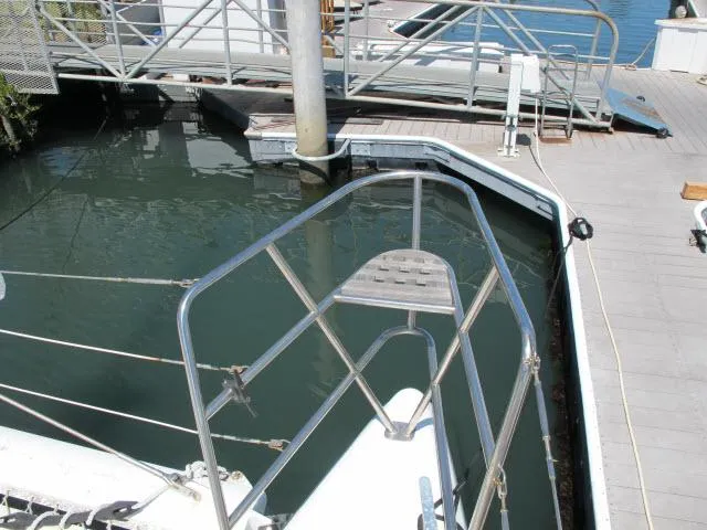 Slide: The Image of Alliaura Privilege 37 catamaran docked at marina, 2000 model, showing bow and railing. - 41