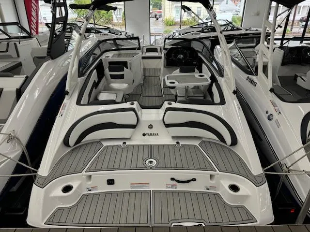Slide: The Image of 2025 Yamaha Boats 195S interior, featuring sleek seating and modern design. - 1