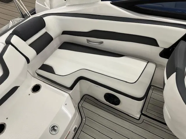 Slide: The Image of 2025 Yamaha Boats 195S interior seating with sleek black and white design. - 12