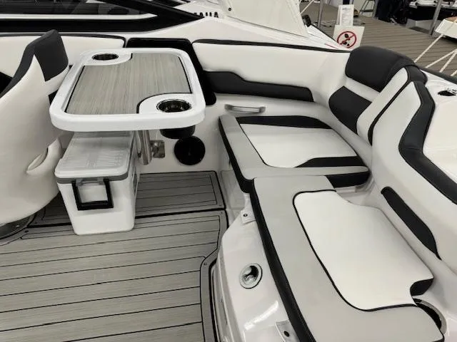 Slide: The Image of 2025 Yamaha Boats 195S interior with sleek seating and modern table design. - 15