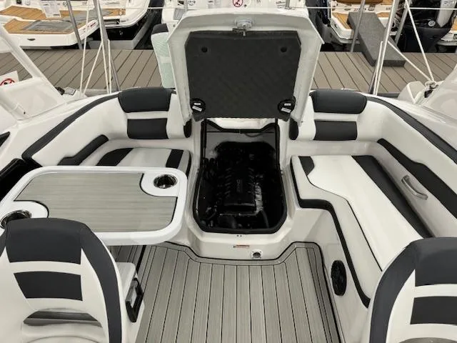 Slide: The Image of 2025 Yamaha Boats 195S interior with open engine compartment and seating area. - 16