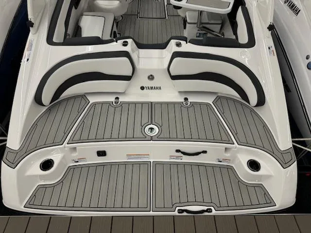 Slide: The Image of 2025 Yamaha Boats 195S, sleek deck design with cushioned seating and modern features. - 18