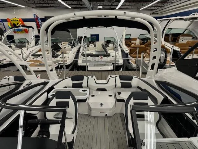 Slide: The Image of 2025 Yamaha Boats 195S interior, sleek design, spacious seating, modern features, showroom display. - 5