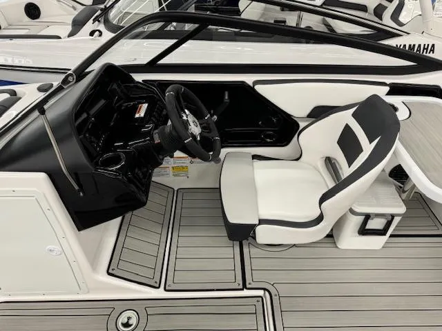 Slide: The Image of 2025 Yamaha Boats 195S cockpit with sleek black and white design, modern steering wheel. - 6