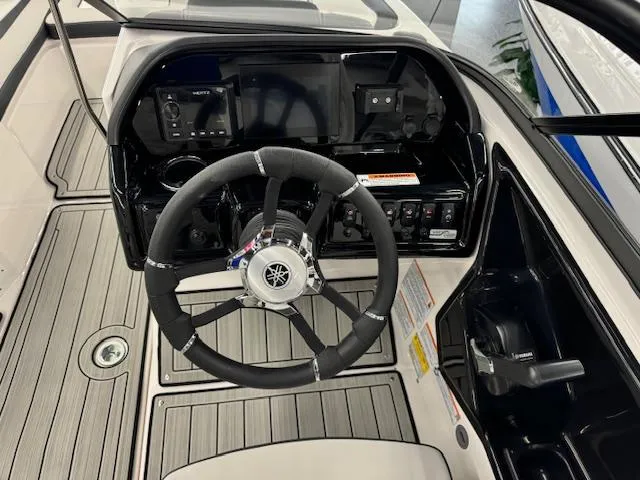 Slide: The Image of 2025 Yamaha Boats 195S steering console with modern controls and sleek design. - 8
