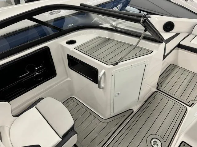 Slide: The Image of 2025 Yamaha Boats 195S interior with sleek seating and modern dashboard design. - 9
