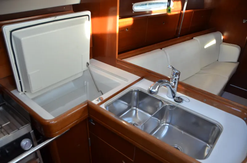 Slide: The Image of Interior of 2002 Beneteau First 36.7 yacht with sink, fridge, and seating area. - 26