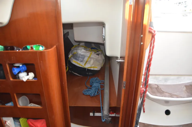 Slide: The Image of Interior storage area of 2002 Beneteau First 36.7 sailboat with ropes and equipment. - 33