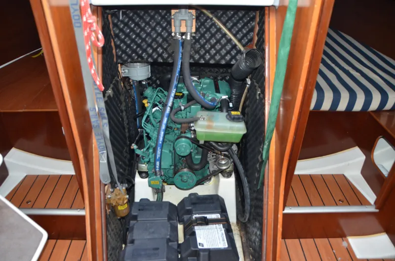 Slide: The Image of Engine compartment of a 2002 Beneteau First 36.7 sailboat, showcasing mechanical components. - 36