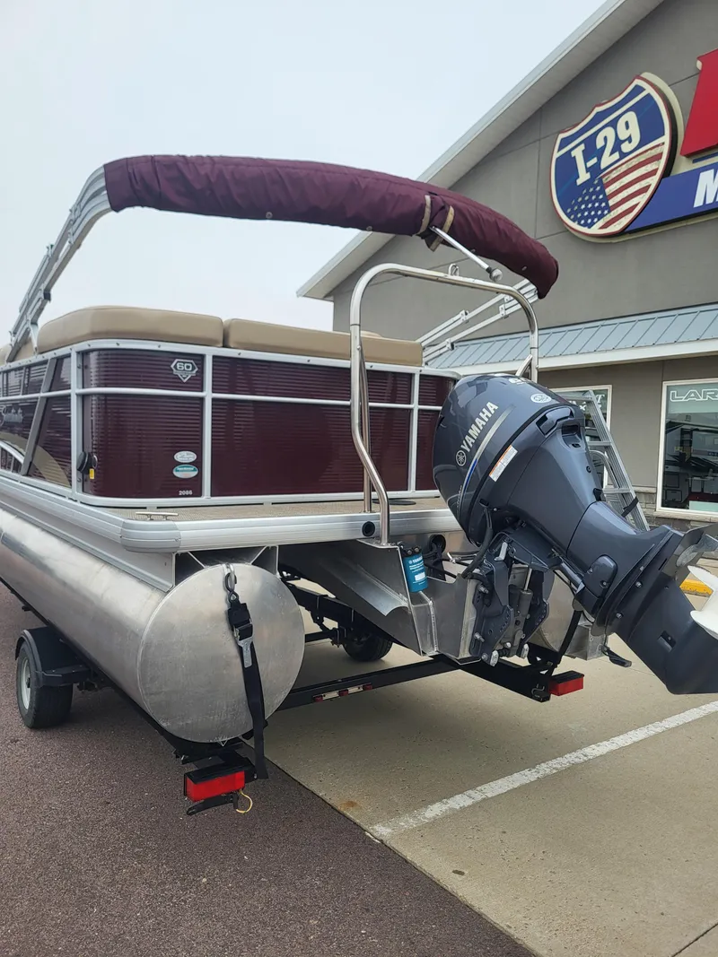 Slide: The Image of 2018 Sweetwater CRUISER pontoon boat with Yamaha outboard motor, parked outside dealership. - 4