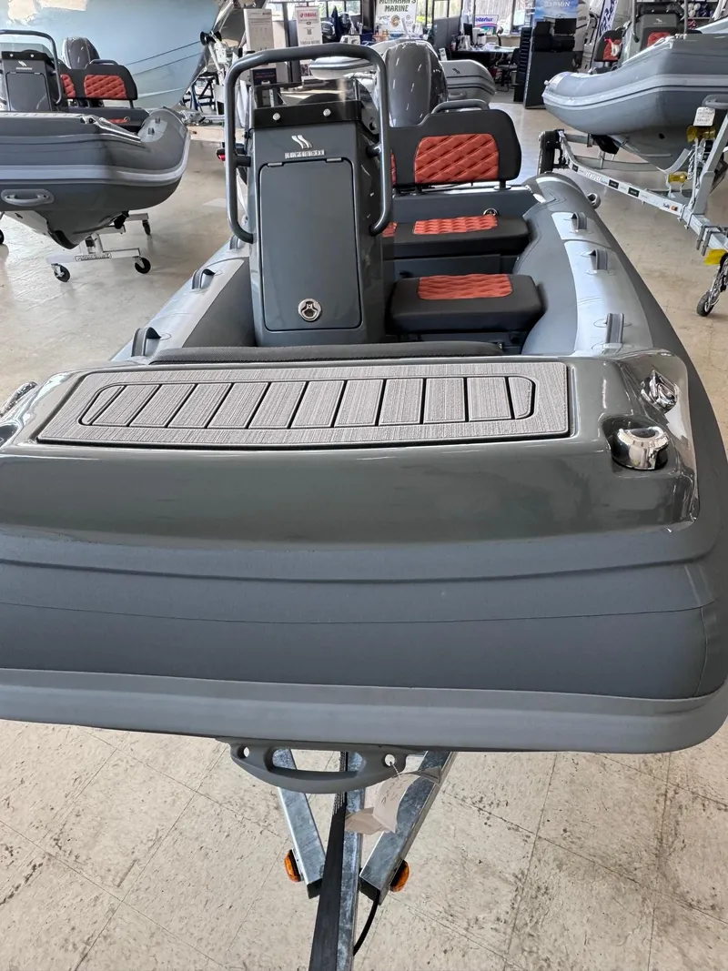 Slide: The Image of 2024 Highfield Sport 330 inflatable boat with sleek design and modern seating. - 3