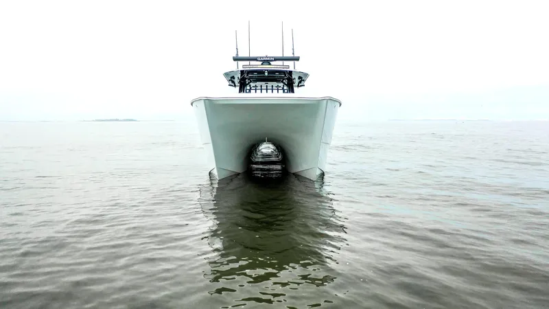 Slide: The Image of Front view of 2023 Freeman 42 LR catamaran on calm water. - 3