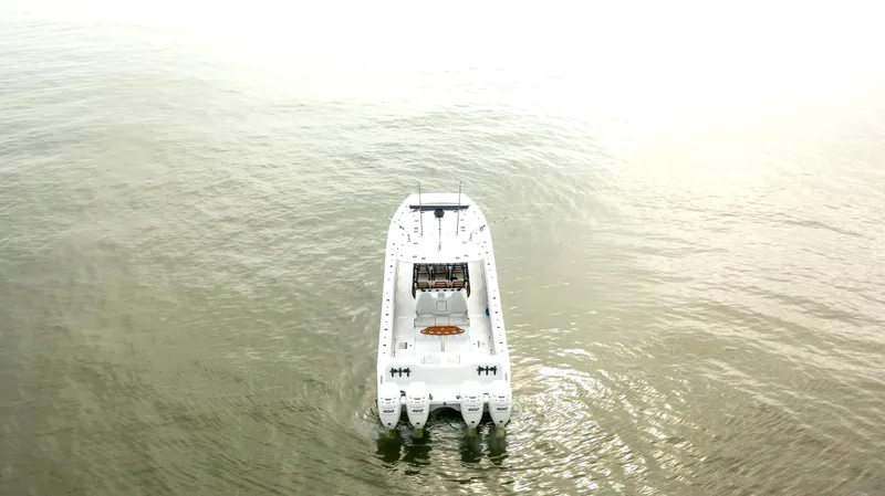 Slide: The Image of Aerial view of 2023 Freeman 42 LR boat on calm water. - 7