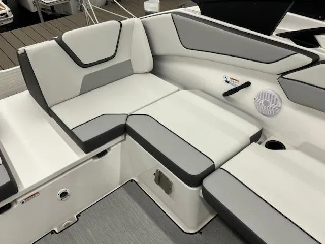 Slide: The Image of 2025 Yamaha AR220 boat interior with gray and white seating. - 11