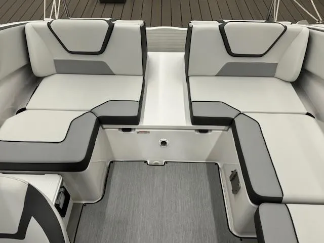 Slide: The Image of 2025 Yamaha Boats AR220 interior seating with modern gray and black upholstery. - 12
